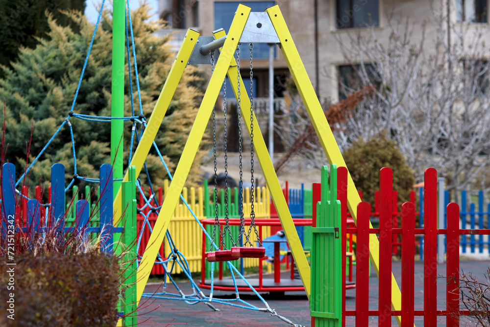 Children's playground in an urban environment. Conflicts between children on walks, no problems of socialization. Children's games outdoors in an organized and safe space.