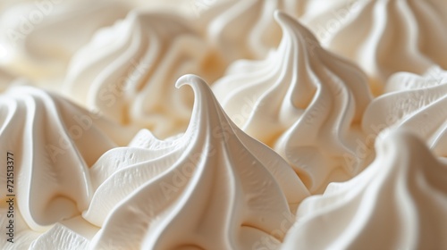 Macro shot of soft, white meringue swirls with selective focus photo