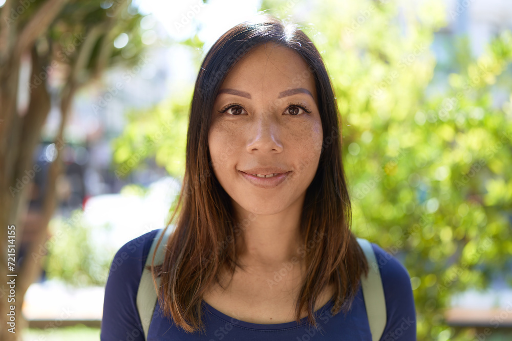 Young asian woman smiling confident standing at park