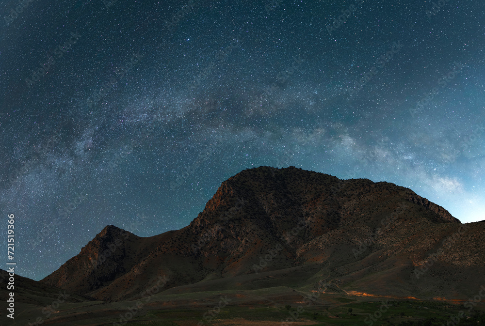 Beautiful night landscape. Mountains landscape  under beautiful bright Milky Way Galaxy.