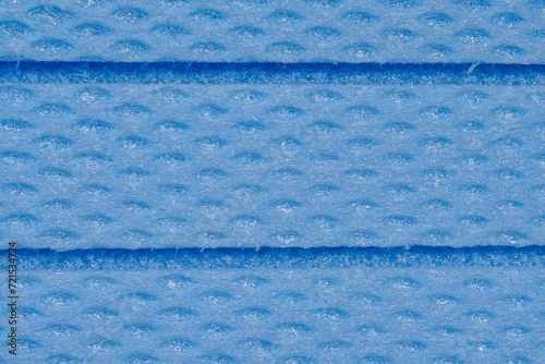 The texture of the blue XPS foam board, showcasing its material composition and surface pattern, detailed close-up shot. photo