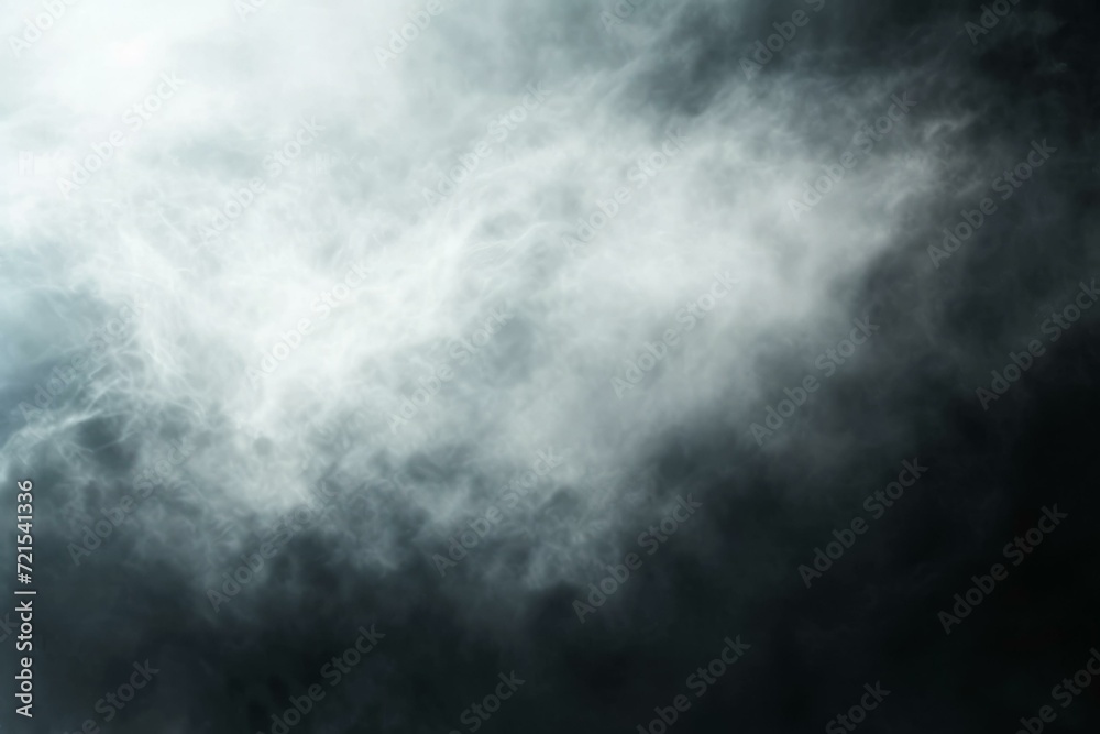 Fototapeta premium Wispy white clouds against a dark background