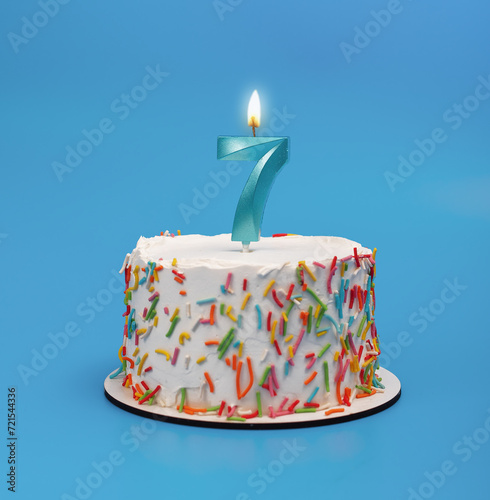 7 shaped candle light on happy birthday cake on blue