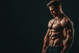 Portrait of muscular bodybuilder on dark background