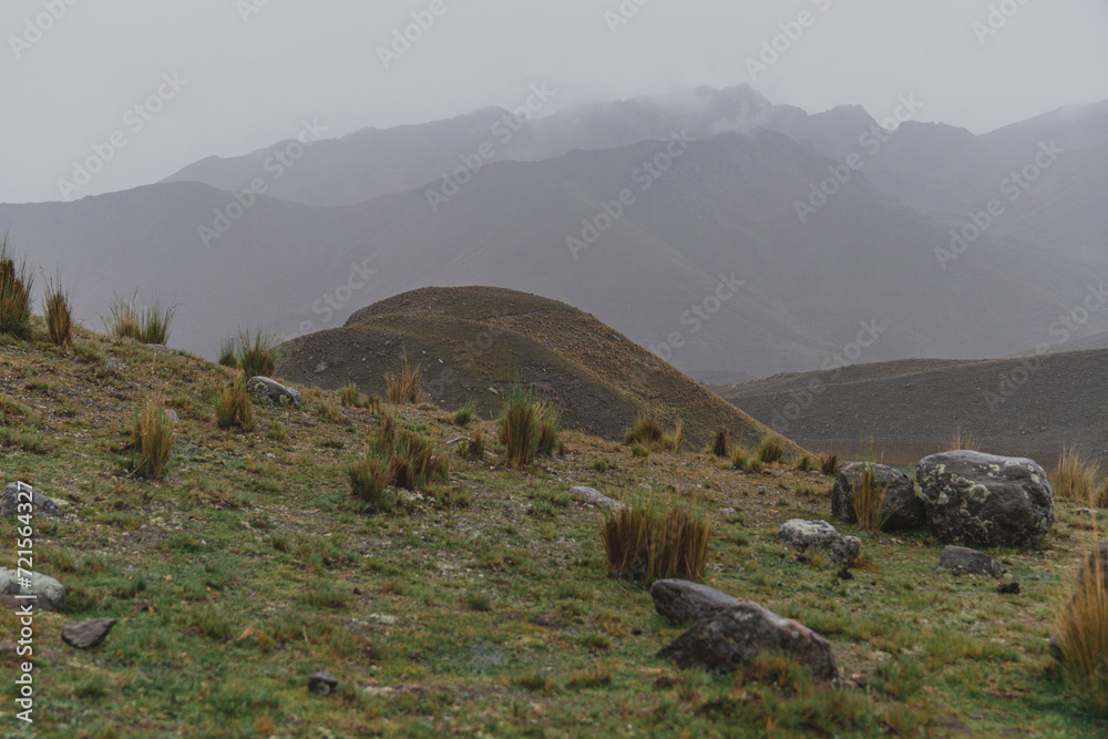 Obraz premium mountain top view, mountains on the horizon under fog and rain 