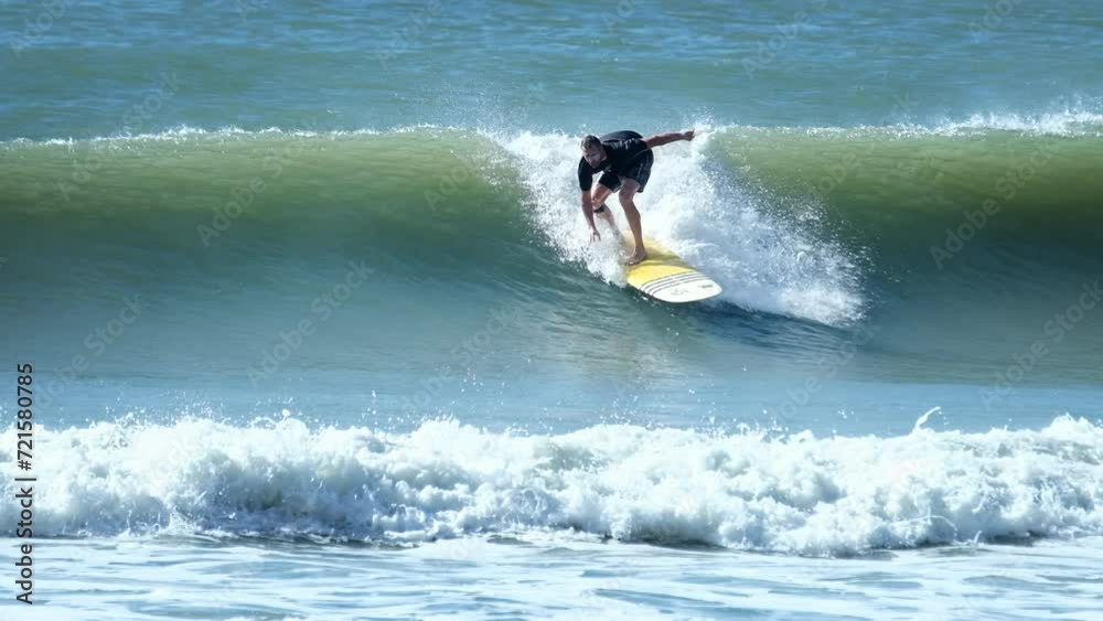 Surfer rides the wave in Brazil