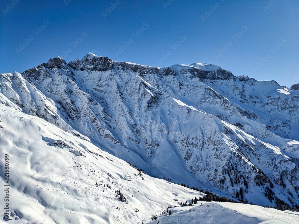 Beautiful view of the snowy Piz Segnas and Piz Sardona. Ski tour to the summit of Färispitz Elm Glarus. Winter wonderland Switzerland. High quality photo