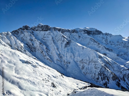 Beautiful view of the snowy Piz Segnas and Piz Sardona. Ski tour to the summit of Färispitz Elm Glarus. Winter wonderland Switzerland. High quality photo