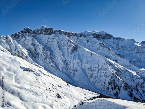 Beautiful view of the snowy Piz Segnas and Piz Sardona. Ski tour to the summit of Färispitz Elm Glarus. Winter wonderland Switzerland. High quality photo © SimonMichael