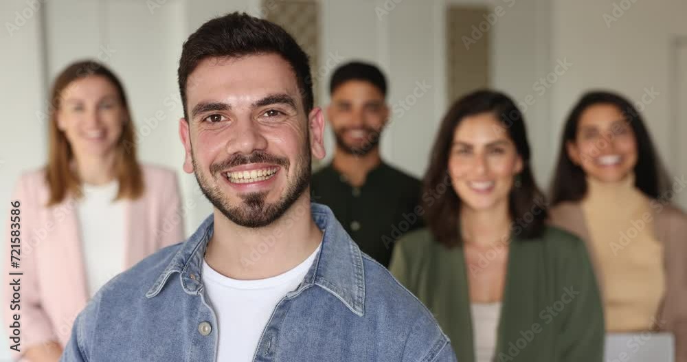 Businessman team leader, Syrian boss posing for camera with multi-ethnic young and ambitious corporate staff members. Human resources, workforce, hiring, promotion, professional business achievements Businessman team leader, Syrian boss posing for camera with multi-ethnic young and ambitious corporate staff members. Human resources, workforce, hiring, promotion, professional business achievements