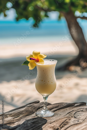 Traditional Caribbean cocktail pina colada in a glasses on a blue slate,stone or concrete background.