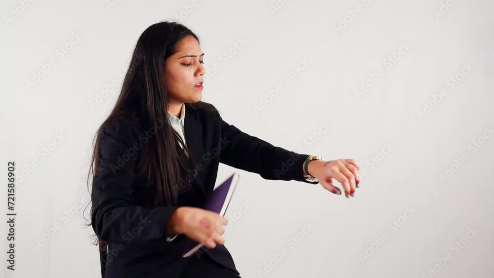 Confident business woman seeing time in watch thoughtful thinking against a white background Confident business woman seeing time in watch thoughtful thinking against a white background