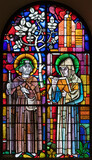 BERN, SWITZERLAND - JUNY 27, 2022: The St. Fridolin and St. Ulrich on the stained glass in the church Dreifaltigkeitskirche by A. Schweri (1938).