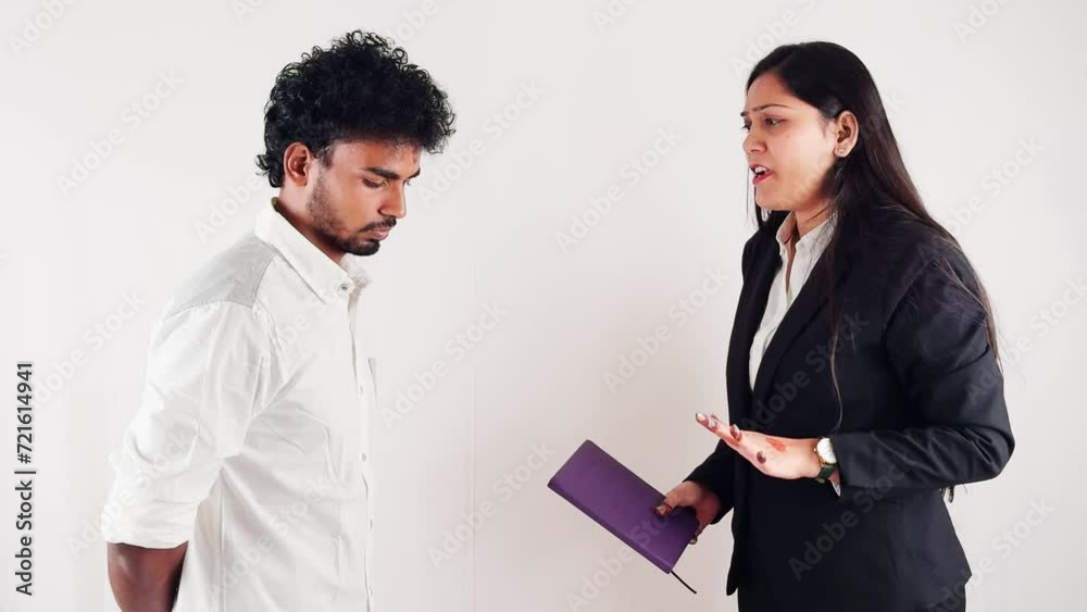 business women scolding to a employ holding notebook facing man with serious expression isolated on white background business women scolding to a employ holding notebook facing man with serious expression isolated on white background