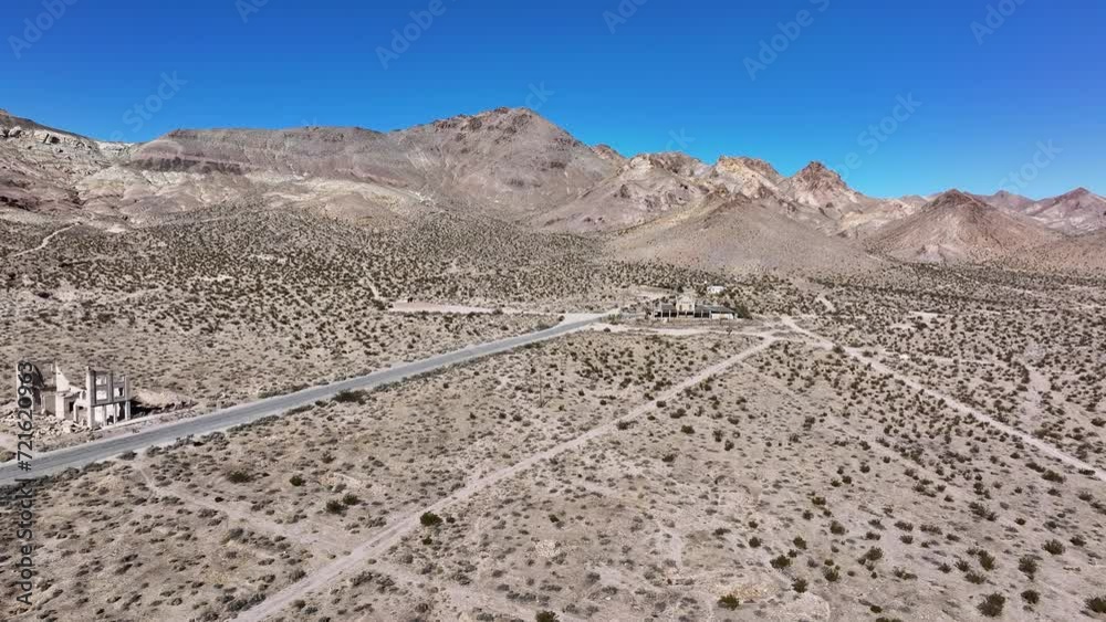 Aerial historic Rhyolite Ghost Town Nevada railroad terminal. Near ...