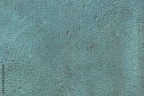 Detailed texture of copper oxide background. Background is a bronze plate covered with oxide green patina, the surface is rough with scratches and gouges. Rough Bronze Texture with Patina.