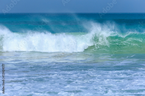 Wave with azure water and white foam approaches on a windy day at Boa Vista s beach  Cape Verde.