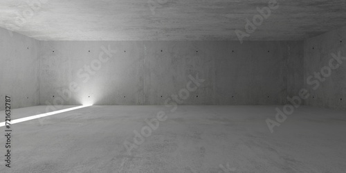 Abstract empty, modern concrete room with vertical light stripe in the floor and rough floor - industrial interior background template © Shawn Hempel