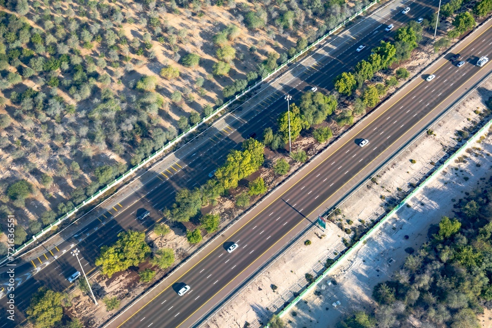 Arial view of highway through the field of trees