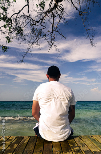 latino person looking at the sea