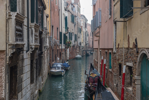 Small canals in Venice, Italy. Ancient architecture, Renaissance palaces and Gothic temples photo