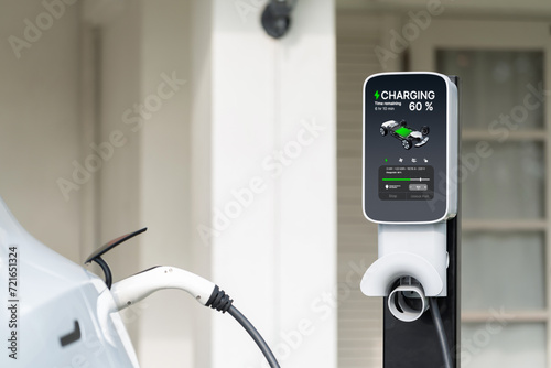 Electric vehicle technology utilized to residential area or home charging station for EV car battery recharge. Eco-friendly transport by clean and sustainable energy for future environment. Synchronos