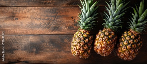 Exquisite Decorative Pineapples on a Rustic Wooden Background: A Decorative Delight with Pineapples, Wooden Charm, and a Background You'll Adore photo