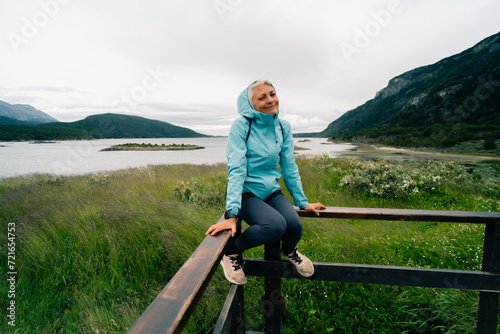 tourist in Bahia Lapataia amidst mountains at Tierra del Fuego