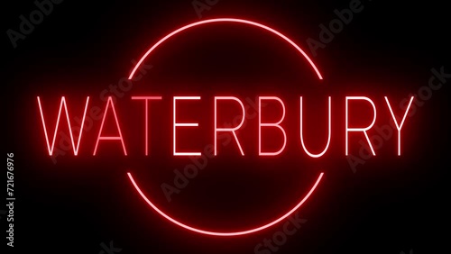 Flickering red retro style neon sign glowing against a black background for WATERBURY photo