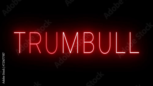 Flickering red retro style neon sign glowing against a black background for TRUMBULL photo