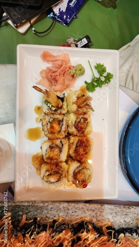 Dynamite prawn sushi rolls  served with garlic in vinegar.