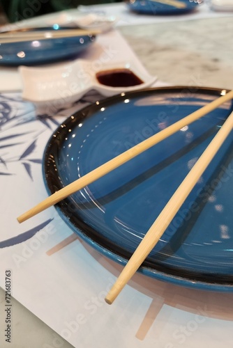 Chopsticks on the plate.