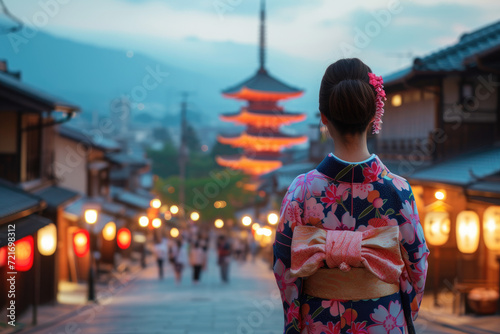 Asian woman wearing japanese traditional kimono at Yasaka Pagoda and Sannen Zaka Street in Kyoto, Japan photo
