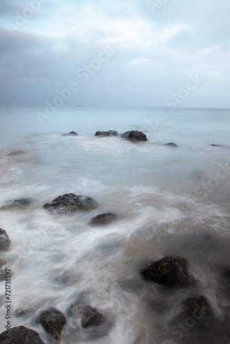 Long exposure shot of the sea and rocks