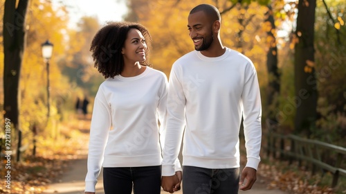 a couple wearing smiling a crew neck 18000 white long sleeve mockup, walking down path in a park  photo