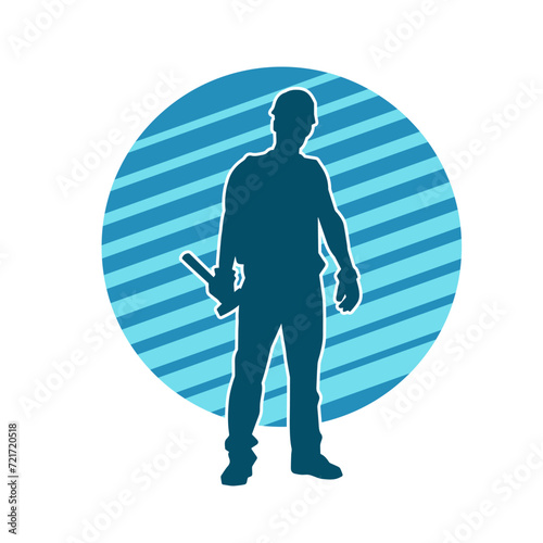 Silhouette of a worker carrying hammer tool. Silhouette of a worker in action pose using hammer tool.