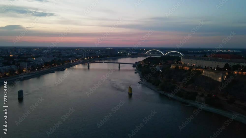 Drone flies over Danube river in city of Novi Sad in evening Drone flies over Danube river in city of Novi Sad in evening