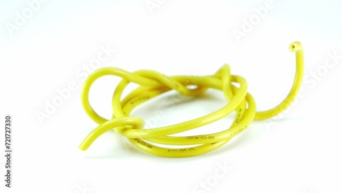 yellow wire cable of usb and adapter isolated on white background.Electronic Connector.Selection focus.Slow motion macro footage. photo