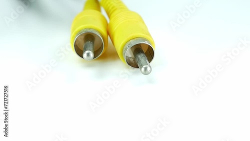 yellow jack cable of adapter isolated on white background.Electronic Connector.Selection focus.Slow motion macro footage. photo