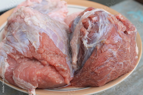 Beef in a plate on the table photo