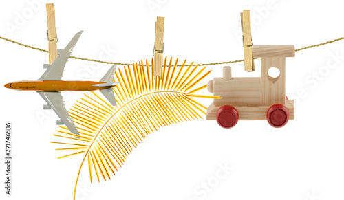 Avion, train et palme d’or sur ficelle, fond blanc 
