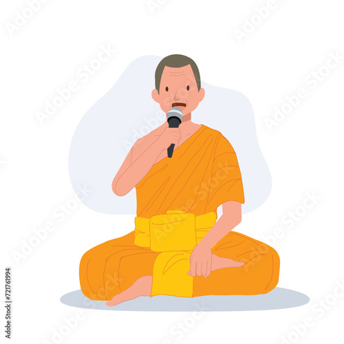 Sitting Thai Monk in Traditional Robes with Microphone is speaking , giving knowledge about buddhist