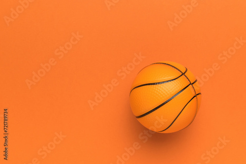 A bright basketball on an orange background.