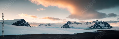 Panoramic view of snowy mountains and glaciers at sunset  Antarctic landscape