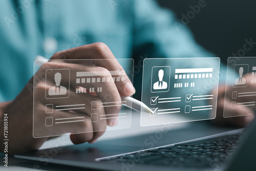 Businessman use laptop to checking resume for employee recruitment. Screening employee information and job applicants. HR, Human resource management concept.