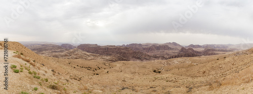 View from the distance from the high hill to the famous gorge in which it is located thr Nabatean Kingdom of Petra in the Wadi Musa city in Jordan