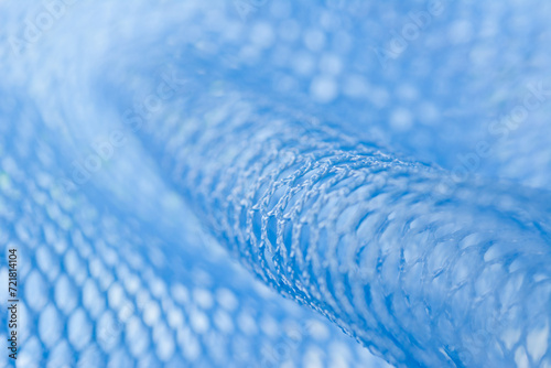 Close up shot of blue nylon mesh fabric.