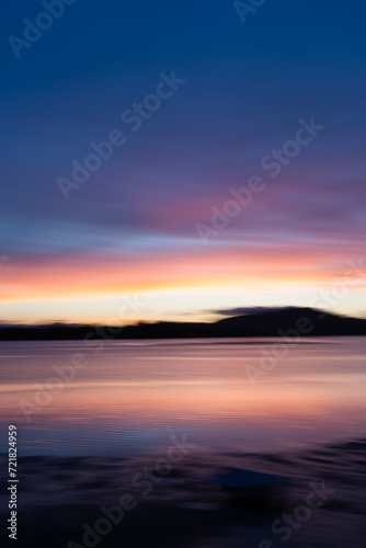 Background sunset intentional camera movement effect soft hues on morning light blue hour.