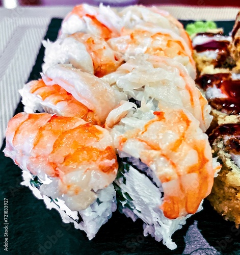 Obraz na płótnie Sushi set on a black plate, close-up, top view w salonie