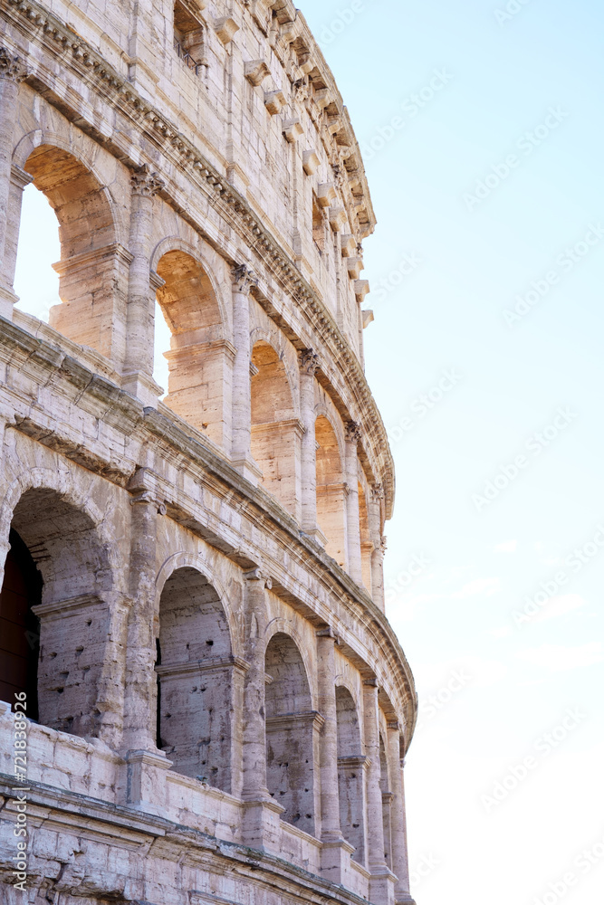 Colosseum in Rome, Italy on cloudy sky background. The Colosseum. Famous place. Historical buuilding on cloudy blue nice sky background